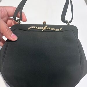 Classic Black Women's Shoulder Bag with Gold Accent